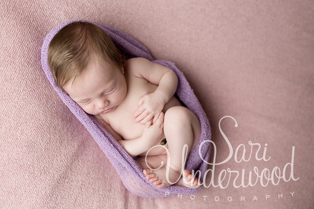 15 day old baby girl in a lavender wrap