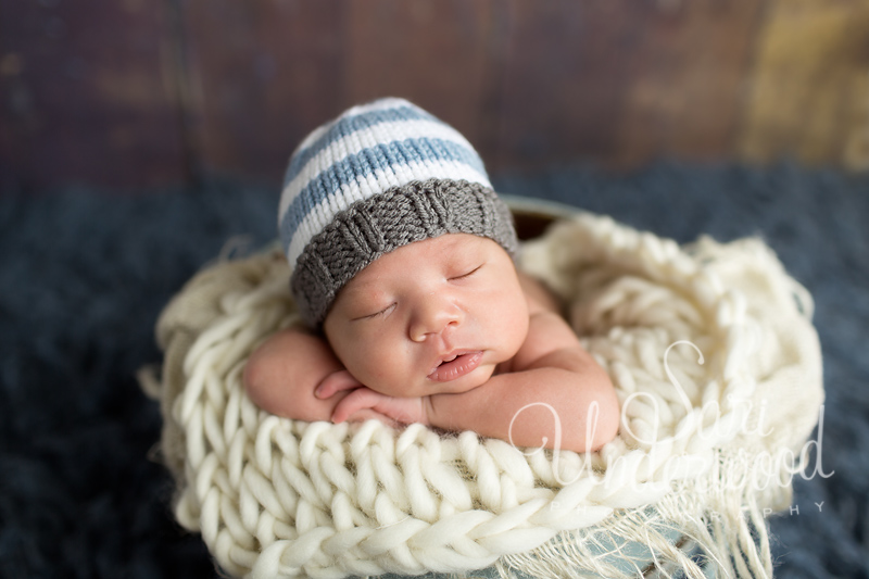 newborn baby boy in a bucket