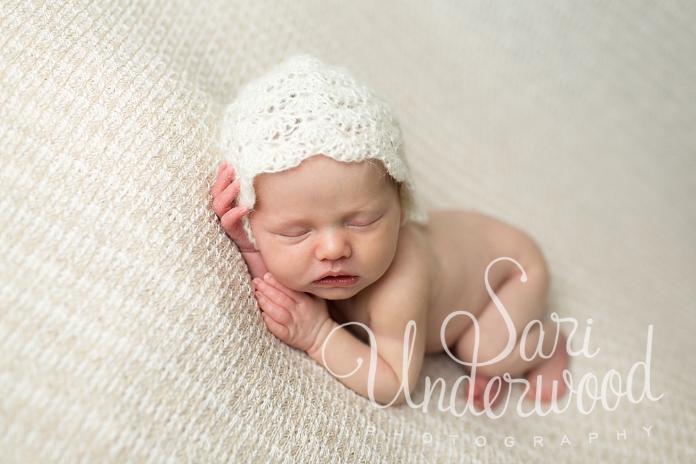 newborn baby girl in classic neutral tones