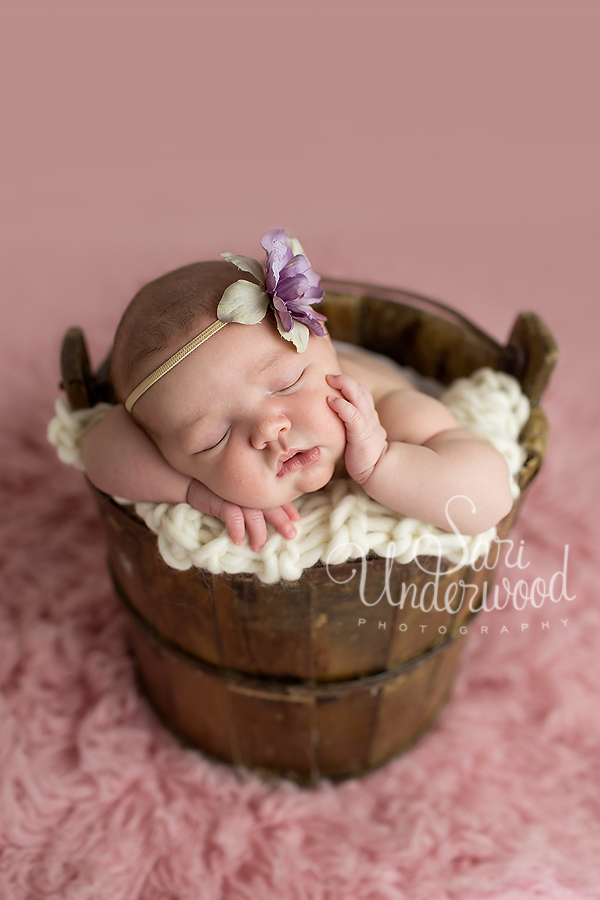 adorable baby girl in old vintage bucket