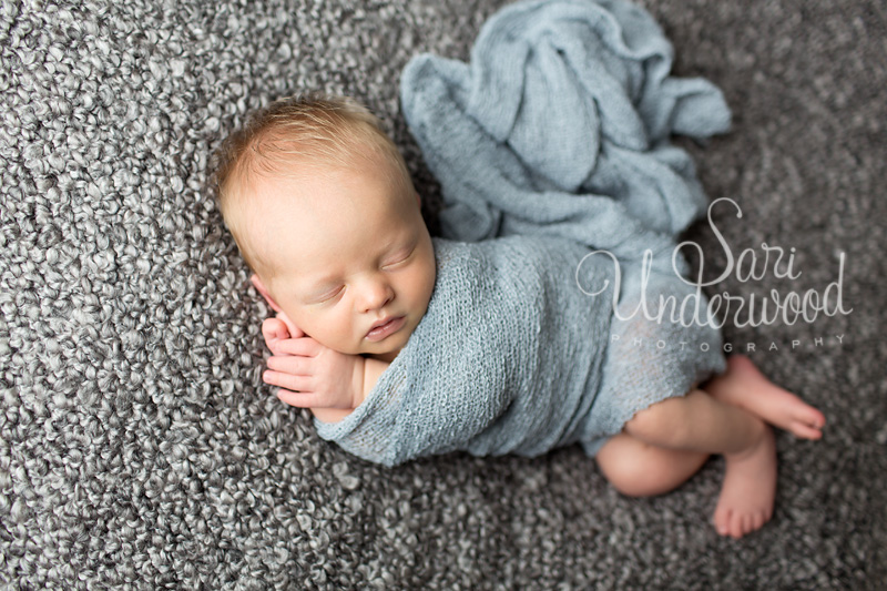 newborn baby boy in light blue and grey